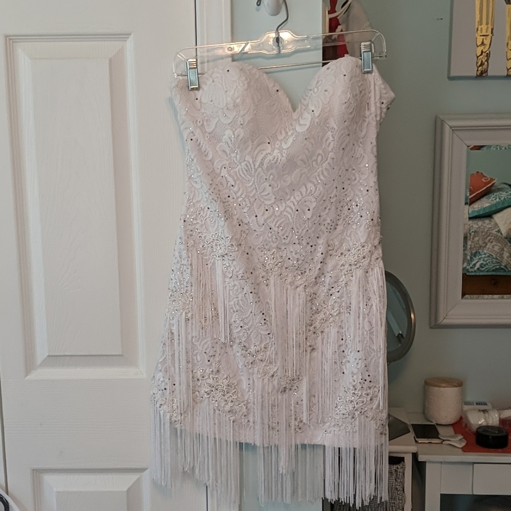 Cocktail dress with sequins and fringe detail.